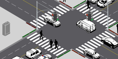 Una baliza semafórica empotrada en el pavimento advierte a los peatones que miran el móvil al cruzar